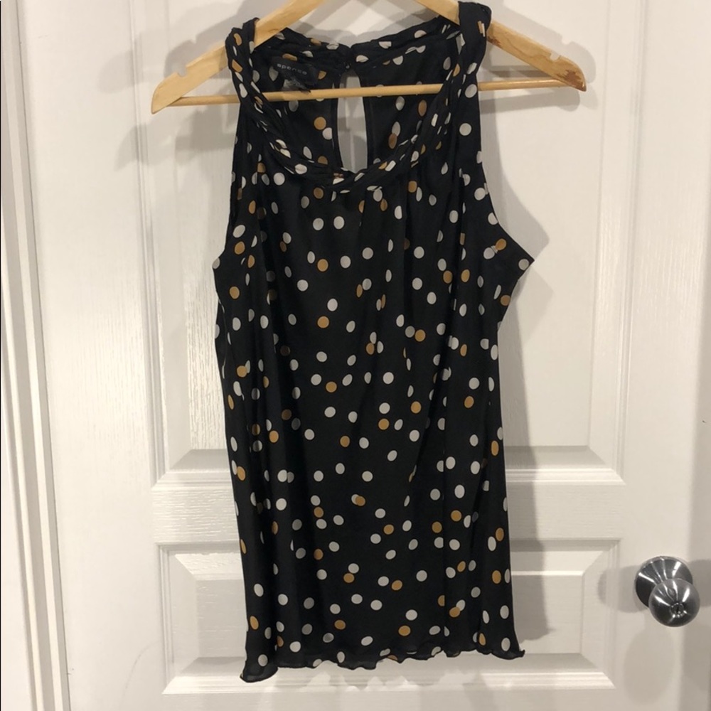 Spense sleeveless polka-dotted blouse.